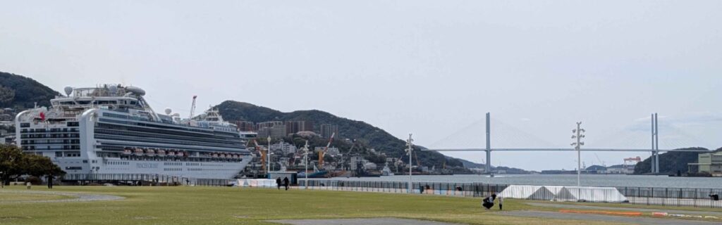 A cruise ship docked near the waterfront park in Nagasaki