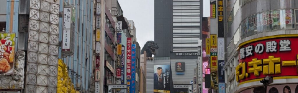 A wide view of the Godzilla statue above Toho Cinema in Shinjuku