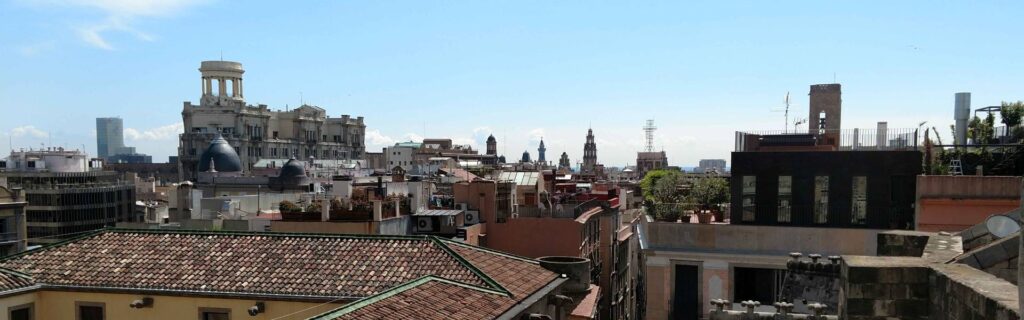 Panoramic view of Barcelona city rooftops and towers