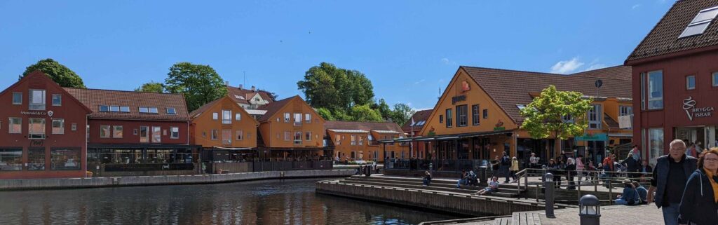 Colorful harbor district and waterfront promenade at Fiskebrygga in Kristiansand.