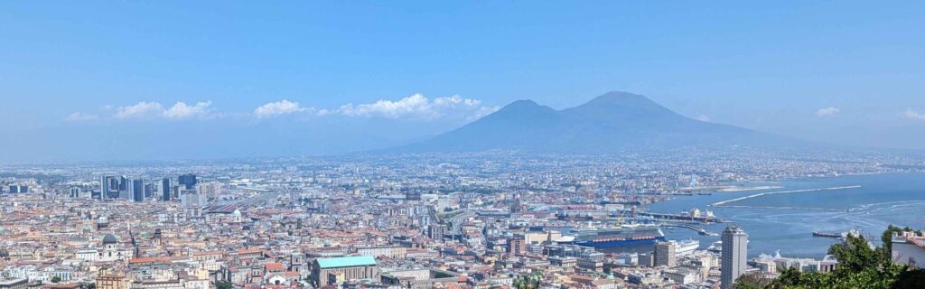 Wide scenic panorama of Naples skyline and Mount Vesuvius