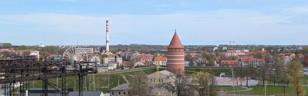 Panoramic view of Klaipėda Castle tower ferris wheel and marina from the ship docked in Klaipėda.